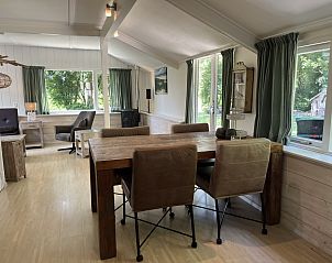 Stylish sitting area in vacation home ZE120, Veere, Walcheren with large windows.