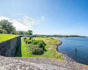 Vintage cabinet in vacation home ZE120, Veere, Walcheren, with decorative items.