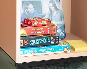 Gezellige spelletjeshoek in Vakantiehuis in Biggekerke, Walcheren, Zeeland. Perfect voor ontspanning en plezier tijdens je verblijf.