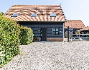 Uitzicht op het uitgestrekte landschap rondom vakantiehuis ZE126 in Grijpskerke, Walcheren.