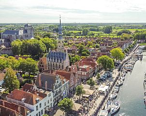 Gezellige woonkamer met houtkachel in vakantiehuis ZE121, Gapinge, Walcheren.