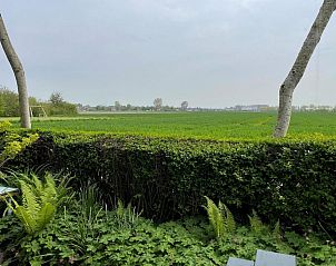Uitzicht op groene velden vanuit VZ2319 Natuurhuisje in Koudekerke-Dishoek, Walcheren, Zeeland.