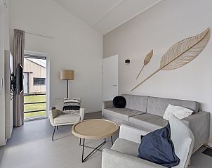 Stylish living room in the Detached house in Breskens, Zeeuws-Vlaanderen, with modern interior and comfortable seating area.
