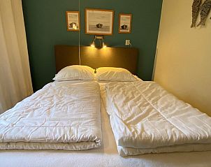 Cozy bedroom in VZ726 Apartment Cadzand, Cadzand-bad, Zeeuws-Vlaanderen with comfortable bed.