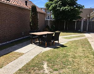 Spacious garden with seating at VZ730 Holiday home Cadzand-Bad in Cadzand-Bad.