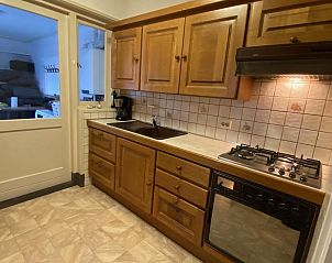 Kitchen with wooden cabinets in VZ730 Holiday home Cadzand-Bad, fully equipped.