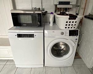 Practical laundry room with appliances in VZ730 Holiday home Cadzand-Bad.
