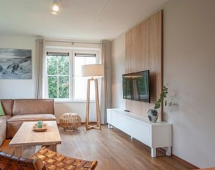 Stylish living room of Villa 4C Luxe in Cadzand-bad, Zeeland, with modern decor and lots of natural light.