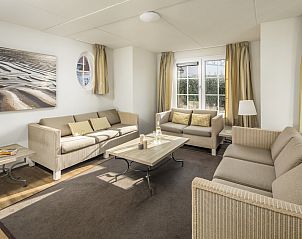 Cozy living room of Watervilla 9A in Cadzand-bad, Zeeuws-Vlaanderen. Comfortable vacation home with lots of light and modern furnishings.