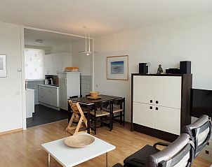 Open kitchen and dining room in VZ922 Holiday apartment in Cadzand, ideal for a relaxing vacation in Zeeland.