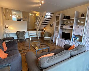 Spacious living room with open staircase in VZ924 Holiday home, Cadzand-bad, Zeeland.