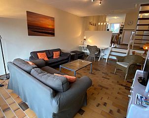 Seating area in VZ924 Holiday home in Cadzand with garden view, Zeeuws-Vlaanderen.