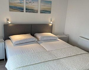 Tweede slaapkamer in Vakantiehuis Waterresort Oosterschelde huisnr. 68, Wemeldinge, met rustige inrichting.