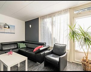 Cozy living room in vacation home Scheldeoord 54, Baarland, South Beveland, with comfortable seating area and natural light.