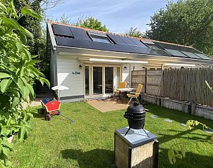 VZ990 Vakantiewoning in Ouddorp met zonnig terras en groene tuin in Goeree-Overflakkee, Zuid-Holland.