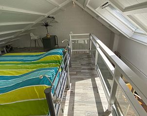Gezellige zolderruimte in VZ990 Vakantiewoning in Ouddorp, ideaal voor rust in Zuid-Holland.