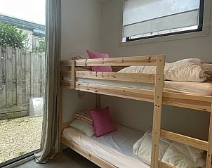 Child-friendly bedroom with bunk beds in House in Ouddorp, vacation accommodation in South Holland.