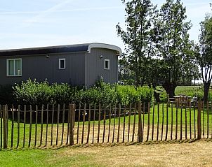 Buitenkant van Huisje in Haastrecht, vakantieverblijf in het Groene Hart, omringd door natuur en rust.