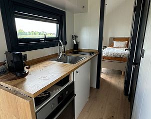 Huisje in Haastrecht, volledig uitgeruste keuken in vakantiehuis in Groene Hart, Zuid-Holland met uitzicht op groen.