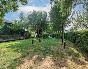 Speeltuin in de tuin van Vakantiehuis in Aarlanderveen, ideaal voor kinderen.