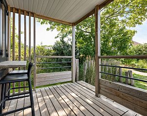 Terrace of Mobil home Beachhome in Ouddorp, offers a beautiful view of the green surroundings of Goeree-Overflakkee, South Holland.