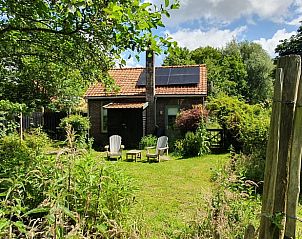 Cozy garden at Holiday home in Oostvoorne, ideal for relaxation in Voorne Putten.