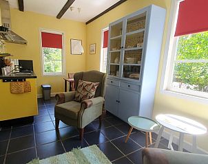 Bright living space in Holiday Home in Oostvoorne, with cozy furnishings and lots of natural light.