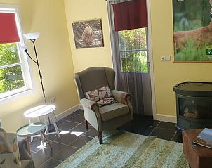 Cozy reading corner in Holiday home in Oostvoorne, ideal for relaxation in South Holland.