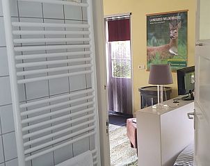 Bathroom with garden view in Holiday home in Oostvoorne, Voorne Putten.