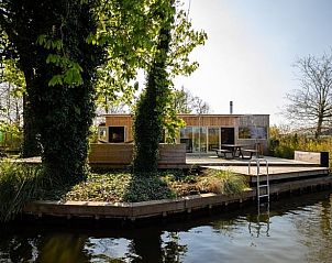 Vakantiehuis in Rotterdam, groene omgeving met terras aan het water, vakantiewoning in Rotterdam eo, Zuid-Holland.