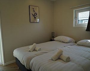 Slaapkamer in Chalet in Dordrecht, een rustige vakantieaccommodatie in Rotterdam eo.