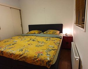 Comfortabele slaapkamer in vakantiehuisje in Groesbeek, ideaal voor rust in het Rijk van Nijmegen, Gelderland.